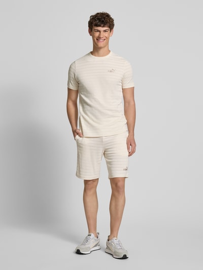 PUMA PERFORMANCE Slim Fit Shorts mit Strukturmuster Modell 'ESS ELEVATED' Offwhite 1