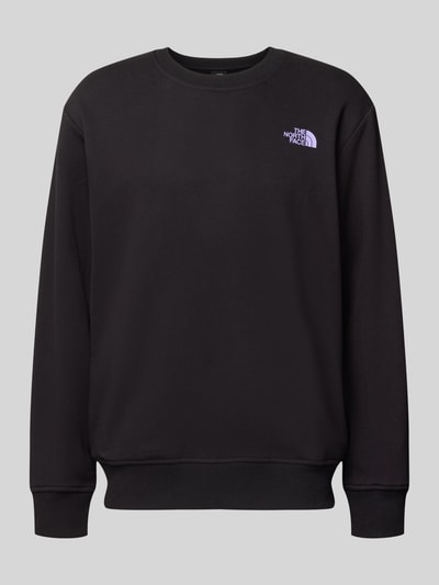 Produktfoto, czarna bluza Sweatshirt mit Label-Print von The North Face z bawełny, krój relaxed fit, prążkowane wykończenia, okrągły dekolt, nadruk z logo