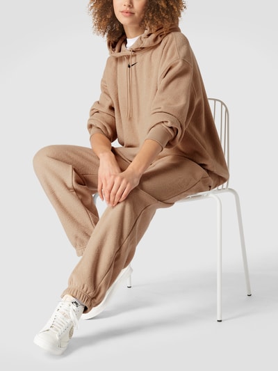 Nike Oversized Sweatpants aus Frottee Beige 1