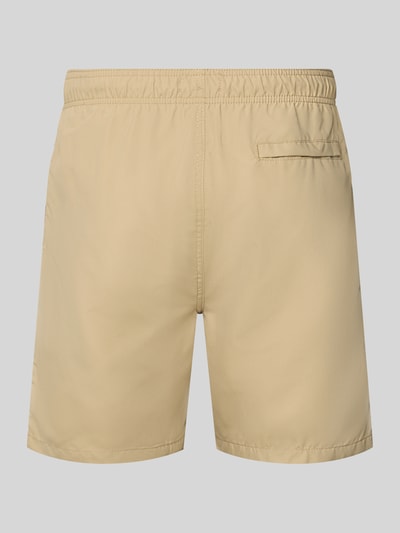 Produktfoto, beige Badehose mit Label-Patch Modell 'Mike' von Shiwi, Loose Fit, elastischer Bund mit Kordelzug, Gesäßleistentasche.