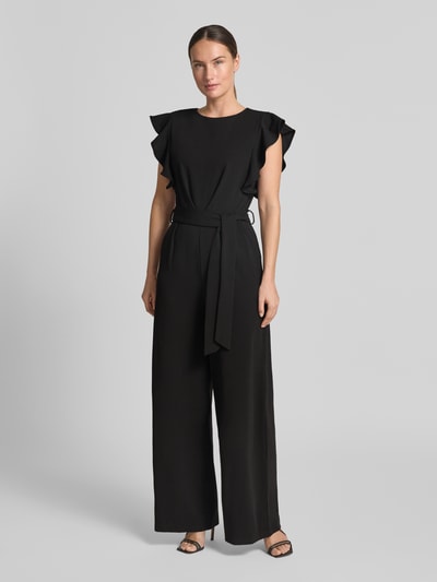 Frauenmodel trägt Jumpsuit mit Rundhalsausschnitt und Bindegürtel von Apricot in Schwarz, Material-Mix mit Stretch-Komfort, Regular Fit, Ganzkörperansicht von vorne.
