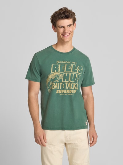 Superdry Loose Fit T-Shirt mit Label-Print Modell 'Roadside Trade' Bottle 4