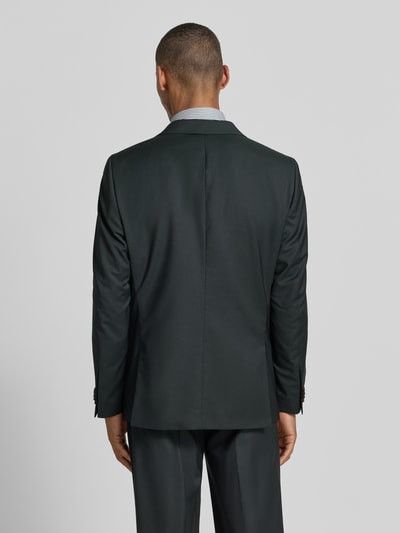 Männermodel trägt Slim Fit 2-knoops colbert model 'Camden' van CG - Club of Gents in zuivere scheerwol met klepzakken, donkere tinten, gladde textuur, ruglengte maat 50: 76 cm, schouderbreedte: 50 cm, mouwlengte: 68 cm, geheel achteraanzicht.
