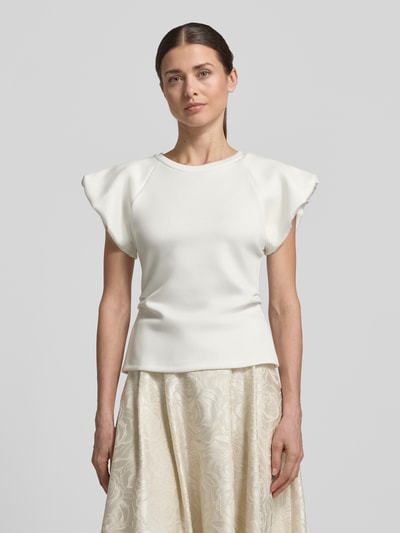 Modelka nosi Blusenshirt aus Viskose-Mix mit Puffärmeln von Rinascimento, kolor biały, krój slim fit, okrągły dekolt, przód, zdjęcie całej sylwetki z przodu.