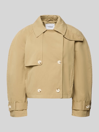 Produktfoto, beige Trenchcoat mit mouwriempjes, knoopsluiting, reverskraag, regular fit, model 'MIA' van Topshop, katoen