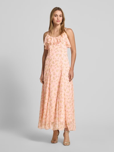 Frauenmodel trägt Abendkleid mit Spaghettiträgern Modell 'SOIREE' von YAS aus Chiffon, taillierter Schnitt, Maxikleid, florales Muster, Rundhalsausschnitt mit Volant, verstellbare Spaghettiträger, zarte Pastellfarben, glatte Textur, Rückenlänge 131 cm, Brustweite 127 cm, Ganzkörperansicht von vorne.