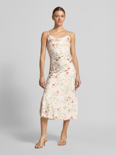 Modelka kobieca nosi Cocktailkleid mit Spaghettiträgern Modell 'THEA' od YAS, satynowa tkanina, prosty krój, midikleid, allover-wzór kwiatowy, spaghettiträger, boczne rozcięcie, długość tyłu w rozmiarze 36: 116 cm, szerokość w rozmiarze 36: 43 cm, widok całej sylwetki z przodu.