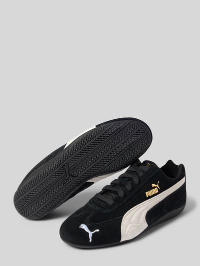 Produktfoto, Sneaker aus Leder-Mix Modell 'Speedcat' von PUMA in Schwarz und Creme mit Logo-Stitching, Label-Details, Abgerundete-Spitze, Schnürung, Absatzhöhe 1 cm, Schafthöhe 7 cm, Schaftweite 8 cm