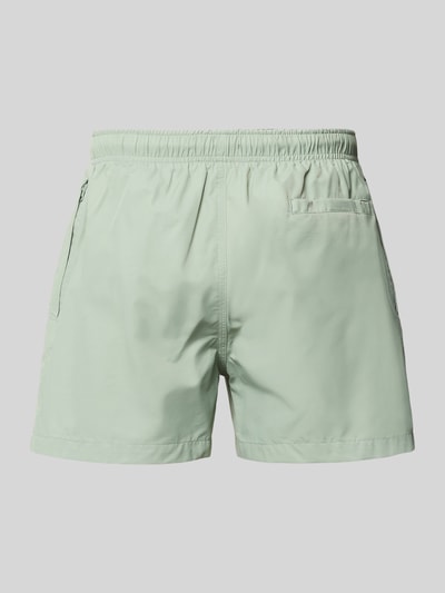 Produktfoto, Badehose mit elastischem Bund und Tunnelzug von MCNEAL in Hellgrün, Baumwoll-Mix, Regular-Fit, glatte Struktur, Rückansicht.