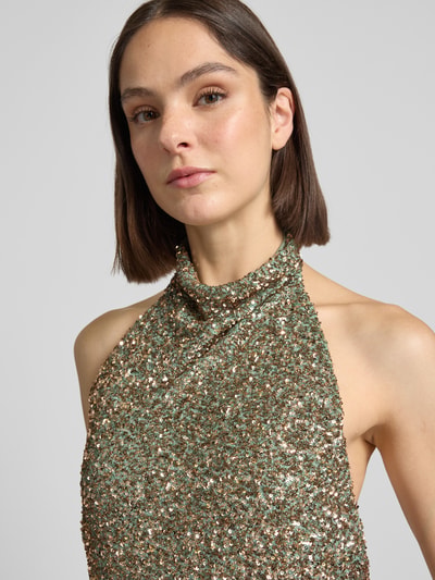 Vrouwenmodel draagt 'Avondjurk met Pailletten' van Swing, materiaalmix met stretch, nauw aansluitend model, maxi-jurk, halter, detailopname bovenlichaam.