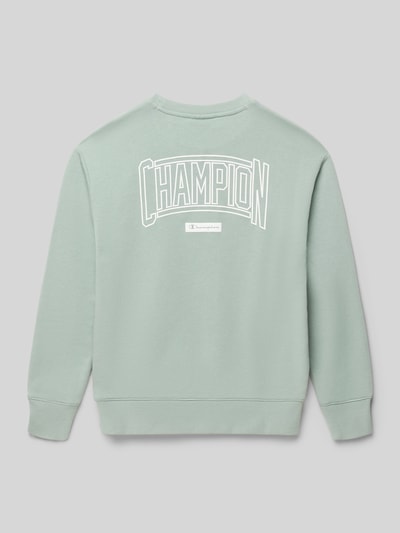 Produktfoto, Regular Fit Poloshirt mit V-Ausschnitt von CHAMPION, Kinder Poloshirt aus Baumwoll-Mix in hellem Grün mit weißem Print.