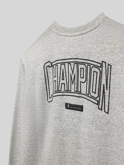 Produktfoto, Regular Fit Poloshirt mit V-Ausschnitt von CHAMPION im Baumwoll-Mix, graue Farbe, sichtbarer Logo-Print auf glatter Oberfläche