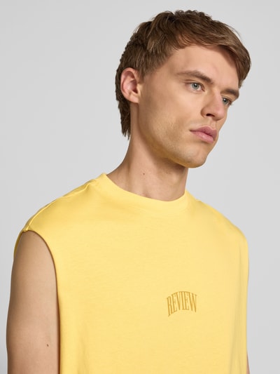 REVIEW Top z nadrukiem z logo Pastelowy żółty 3