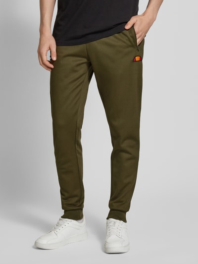 Ellesse Spodnie typu track pants o kroju tapered fit z naszywkami z logo model ‘BERTONI’ Khaki 4