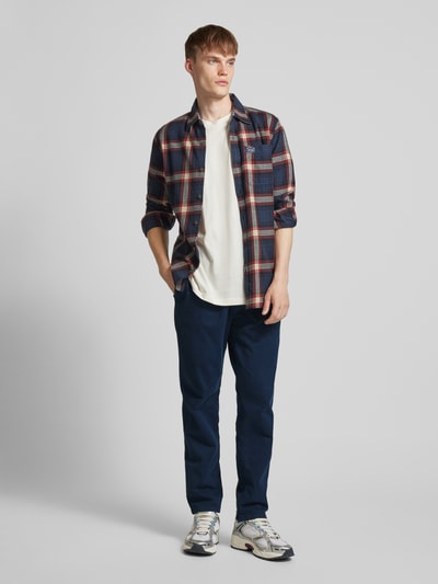 Tommy Jeans Tapered Fit Bundfaltenhose mit elastischem Bund Marine 1