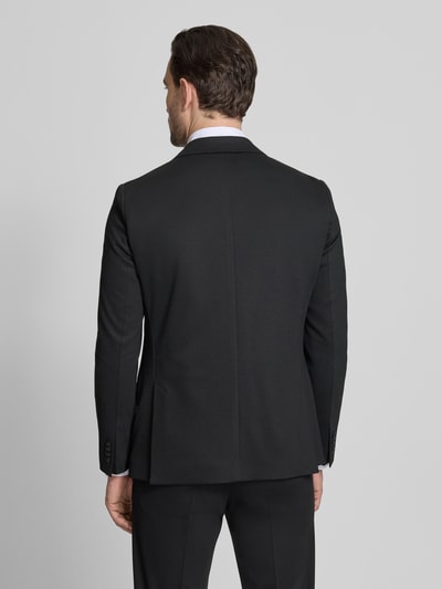 Männermodel trägt Extra Slim Fit Anzug in jednokolorowy design von Roy Robson, mieszanka wiskozy z dodatkiem streczu, marynarka na 2 guziki, kołnierz z połami, kieszenie z patką, kanty, wpuszczane kieszenie, szerokość w rozmiarze 50: 43 cm, długość tyłu: 73 cm, szerokość ramion: 42 cm, długość rękawów: 65 cm, długość wewnętrzna nogawki: 80 cm, całkowity widok z tyłu