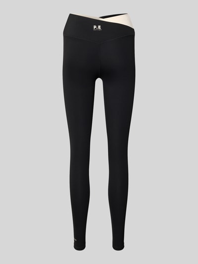Produktfoto, High Rise Leggings in asymmetrischem Look von P.E Nation, Schwarz mit weißem Akzent, Material-Mix mit Stretch-Anteil, körpernahe Passform
