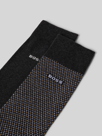 Produktfoto, Socken mit Label-Detail im 2er-Pack von BOSS z mieszanki bawełny ze streczu, prążkowane ściągacze, detal z logo, kolor czarny i wzór.