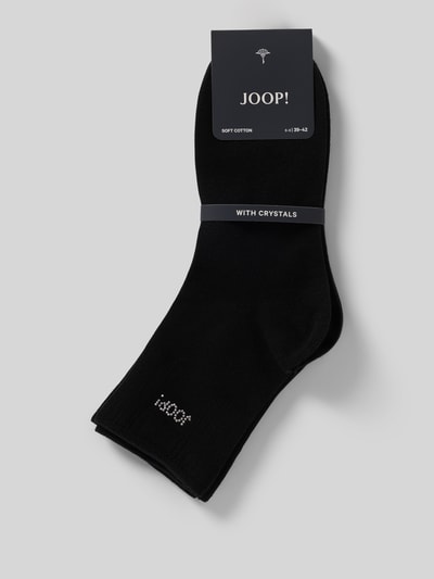 Produktfoto, schwarze Socken mit Strasssteinbesatz von JOOP!, Baumwoll-Mix mit Modal-Anteil, Logo-Detail, elastischer Bund, glatte Struktur