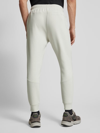 Under Armour Relaxed Fit Sweatpants mit Logo-Print Modell 'Unstoppable' Offwhite 5