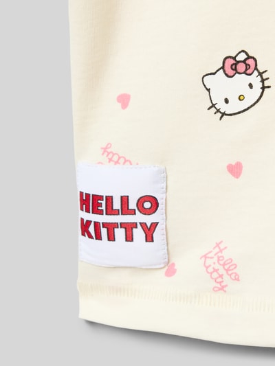 Produktfoto, Regular Fit T-Shirt aus reiner Baumwolle Modell 'KITTY' von Only mit Allover-Muster, Label Stitching, Feinripp, unifarben, Motiv und Applikation in Rosa auf hellem Stoff.