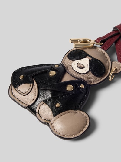 Produktfoto, Anhänger mit Nietenbesatz Modell 'Allegra' von FURLA im Teddy-Design, Ledertextur in Schwarz, Beige und Gold, Charm-Look