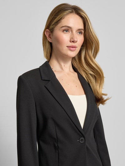Frauenmodel trägt Blazer mit Reverskragen von Comma, Viskose-Mix mit Stretch-Anteil, Slim-Fit, Knopfverschluss, Nahaufnahme Oberkörper.