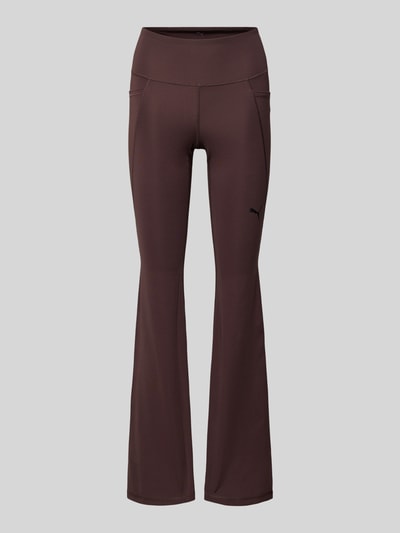 Produktfoto, braune Flared Leggings mit Logo von PUMA aus Material-Mix mit Stretch-Anteil, High Waist, elastischer Bund, glatte Textur.