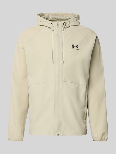 Produktfoto, Regular Fit Jacke mit Logo-Print Modell 'Vibe' von Under Armour, elastyczna mieszanka materiałów, kaptur z tunelem, zamek błyskawiczny, wpuszczane kieszenie, długość tyłu w rozmiarze M 70 cm, długość rękawów 72 cm, kolor jasnobeżowy, gładka faktura