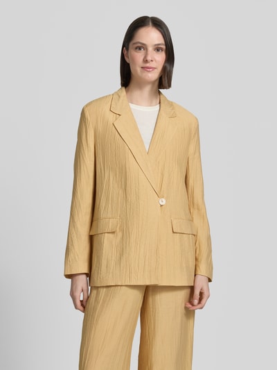 Frauenmodel trägt Straight Fit Blazer aus Viskose-Mix mit Strukturmuster von Jake*s Collection, gelb, Reverskragen, Pattentaschen, Knopfverschluss, Leinen-Viskose-Anteil, Ganzkörperansicht von vorne.