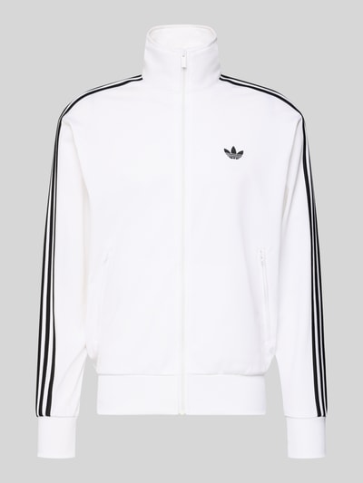 Produktfoto, Trainingsjacke mit Stehkragen von adidas Originals in Weiß mit schwarzen Streifen, Reißverschluss und Label-Stitching, Regular Fit, gerippte Abschlüsse, Reißverschlusstaschen, glatte Struktur