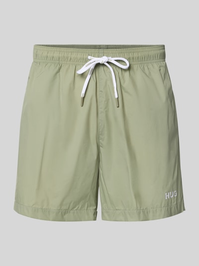 Produktfoto, Badeshorts mit Label-Print Modell 'HAITI' von HUGO, Optik: Unifarben, Tunnelzug, Bundabschluss: elastisch, seitliche Eingrifftaschen, Gesäßtasche, glatte Oberfläche, dezentes Grün