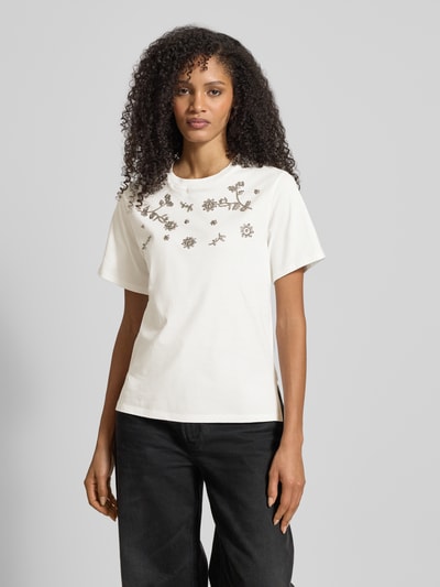 Frauenmodel trägt Slim Fit Damen T-Shirt aus reiner Baumwolle Modell 'DAGILE' von Weekend Max Mara, Optik: Unifarben, Logo-Print, Pailletten, Rundhals, Kurzarm, gerade Abschlüsse, Ganzkörperansicht von vorne.