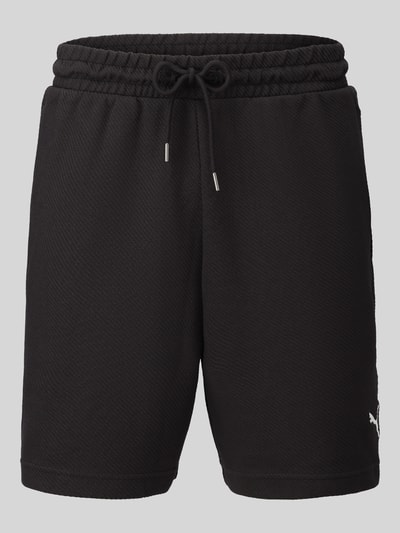 Produktfoto, schwarze Relaxed Fit Sweatshorts aus Baumwoll-Mix 'ESS ELEVATED' von PUMA, Herren Sweatshorts von PUMA Performance, glatte Struktur
