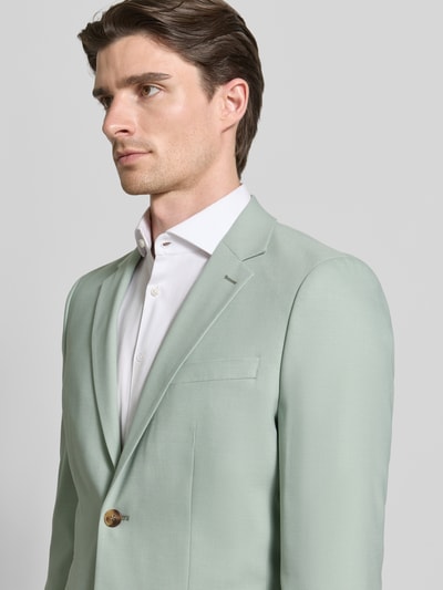 Männermodel trägt Slim Fit Anzugsakko mit Woll-Anteil Modell 'SLIM-NEIL' von SELECTED HOMME, Optik: Unifarben, Nahaufnahme Oberkörper.