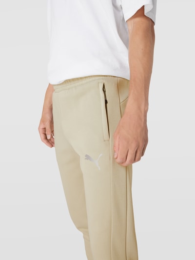 PUMA PERFORMANCE Sweatpants mit Reißverschlusstaschen Modell 'Evostripe Pants' Sand 3