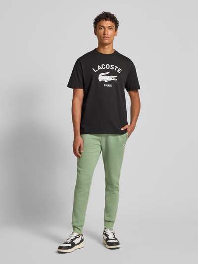 Lacoste Spodnie dresowe o kroju slim fit z mieszanki bawełny Zielony 1