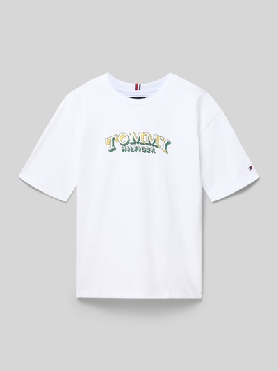 Produktfoto, Regular Fit T-Shirt aus reiner Baumwolle von Tommy Hilfiger Teens, Kinder T-Shirt, Optik: Unifarben, Label-Print, Logo-Stitching, Rundhals, Kurzarm, Reine Baumwolle, glatte Textur, weiß mit farbigem Print.