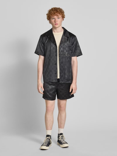 KARL KANI Relaxed Fit Shorts mit Allover-Logo-Print Modell 'Signature' Black 1