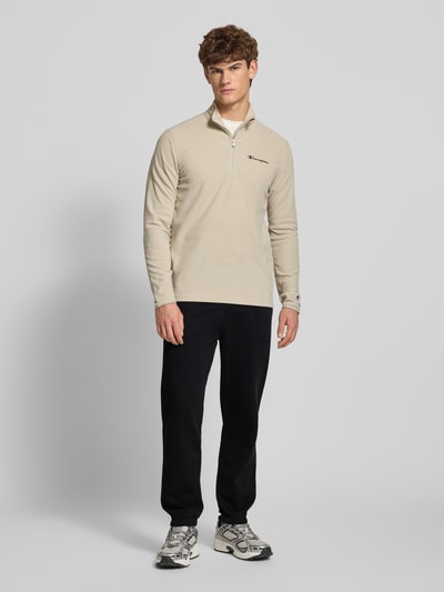 CHAMPION Spodnie dresowe z elastycznym ściągaczem Czarny 1