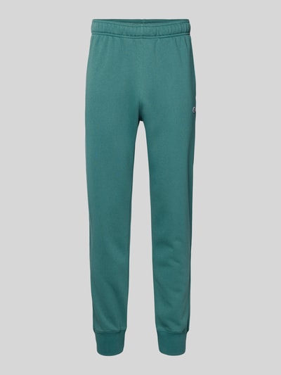 Produktfoto, Sweatpants mit elastischem Bund und Label-Stitching von CHAMPION aus Baumwoll-Mix im Regular-Fit, smaragdgrün, Innenbeinlänge 76 cm.