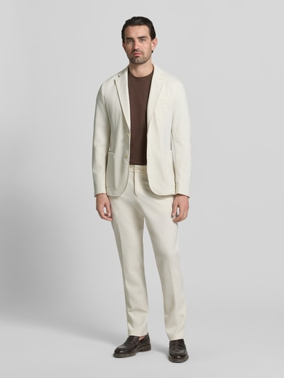 Mannelijk model draagt Slim Fit Sakko met Viskose-Anteil Modell 'P-HANRY-J-WG-PK-261F' van BOSS in effen beige, geheelvooraanzicht.