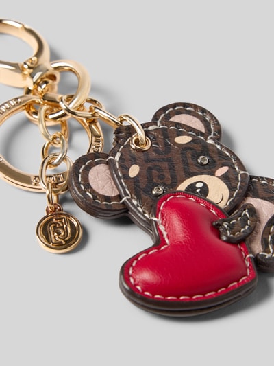 Produktfoto, Schlüsselanhänger mit Motiv Modell 'BEAR KEY RING' von Liu Jo White mit Bärendesign, rotem Herz, goldfarbenem Spaltring und Label-Details, strukturierte Oberfläche