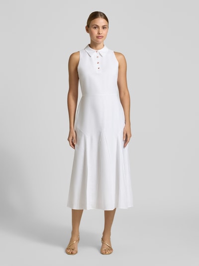 Frauenmodel trägt Midikleid mit Umlegekragen Modell 'Meeha' von Ted Baker in Weiß, taillierte Passform, Material-Mix, Ganzkörperansicht von vorne.