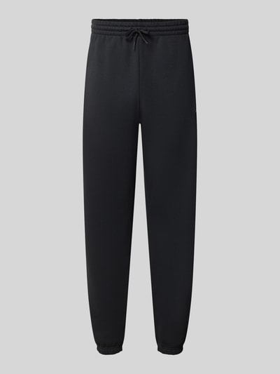 Produktfoto, Regular Fit Sweatpants aus Baumwoll-Mix mit Label-Stitching von New Balance, Schwarz, elastischer Bund mit Tunnelzug, glatte Struktur