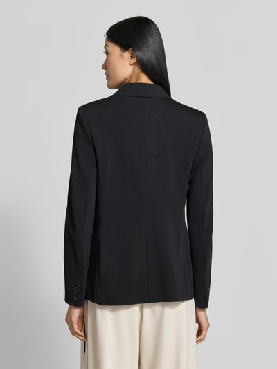 Frauenmodel trägt Regular Fit Longblazer mit doppelter Knopfleiste Modell 'WKDCOLIBRI' von Max Mara in Schwarz, glatte Textur, Ganzkörperansicht Rückansicht.
