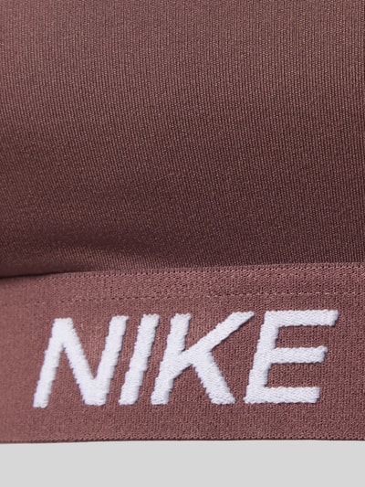 Produktfoto, stanik 'Bustier mit Label-Details und verstellbaren Trägern' od NIKE TRAINING w kolorze brązowym, elastyczny pas z logo, dopasowany krój