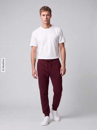 adidas Sportswear Spodnie dresowe o kroju regular fit z mieszanki bawełny model 'FEELCOZY' Ciemnoczerwony 1