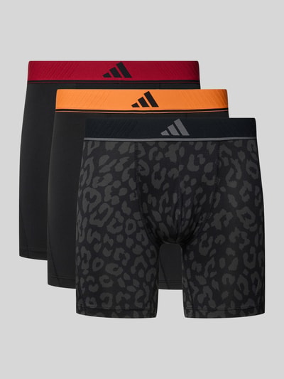 Produktfoto, Trunks im 3er-Pack mit elastischem Logo-Bund von adidas Sportswear, Optik: Unifarben, Logo-Print, Bundabschluss: Elastisch, Multipack: 3er-Pack, Materialverarbeitung: Jersey, in Schwarz mit rotem, orangem und schwarz-grauem Leopardenmuster.