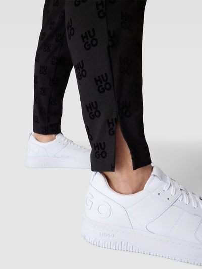 HUGO Sweatpants mit Allover-Logo-Muster Modell 'Flock' Black 3